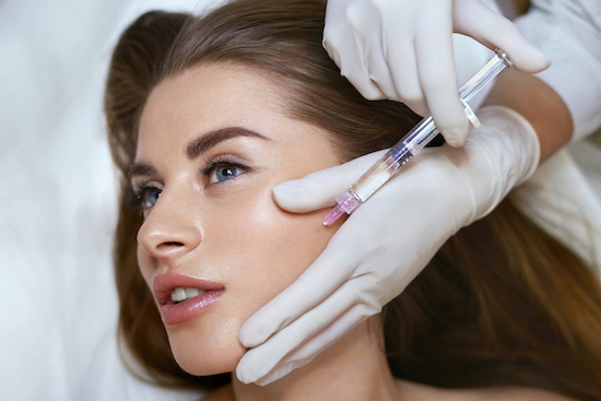 Beauty Injection. Anti Aging Non Surgical Mesotherapy For Young Woman's Face In Cosmetic Salon. Beautician's Hands With Syringe.